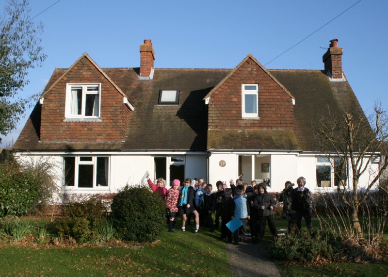 The children outside a local house